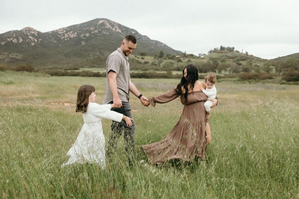 Family walks through Newbury Park field for their Ventura County family photos