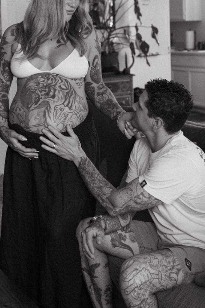 Couple embrace in their at home family maternity session in Ventura County